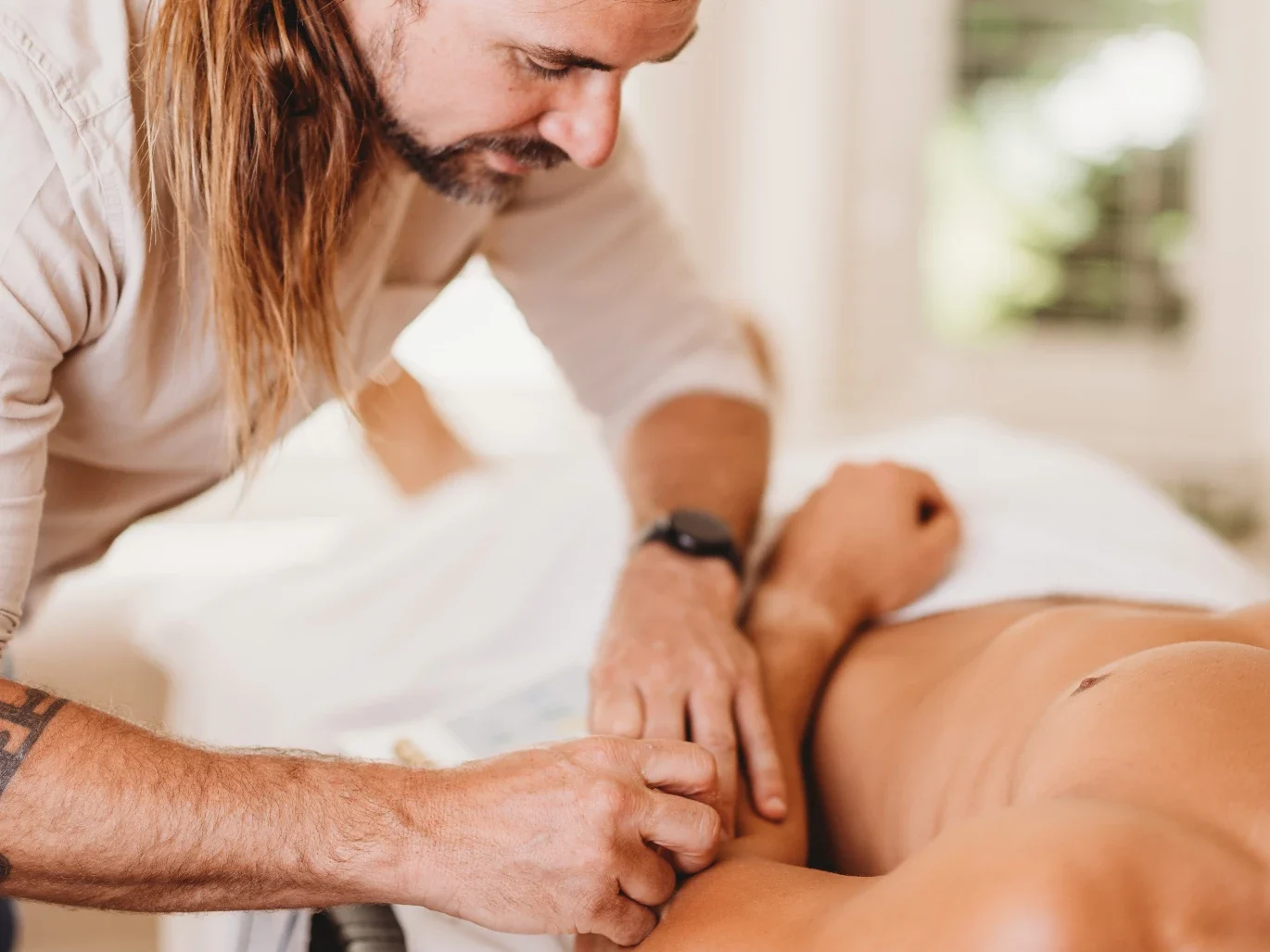 Dr. Truth Robinson performing trigger point dry needling at Ascend Acupuncture Byron Bay